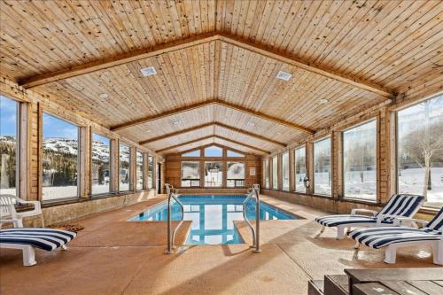 a large room with a swimming pool in a house at Brian Head Condo Rental in Brian Head