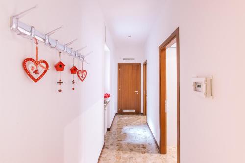 a hallway with hearts hanging on the wall at San Nicolò 3 in Verona