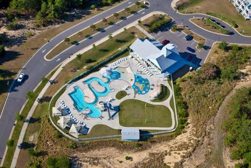 an aerial view of a resort with a pool at The Wright Stuff OBX in Kill Devil Hills