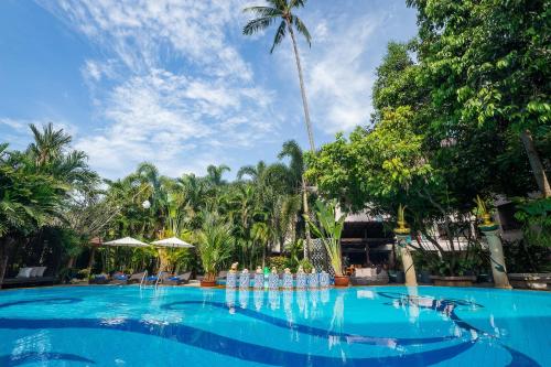 a large swimming pool with a water game in a resort at Aonang Princeville Villa Resort & Spa - GHA WellHotel-Halal Certified, Krabi, Thailand in Ao Nang Beach