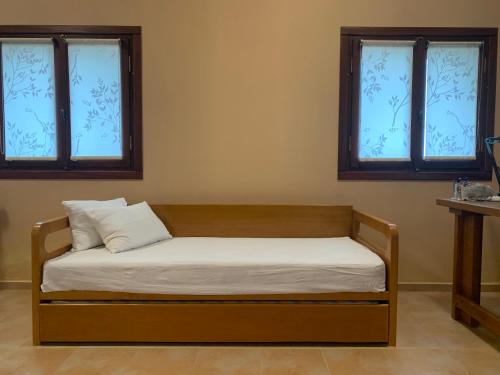 Ein Bett oder Betten in einem Zimmer der Unterkunft Iris Bioclimatic House