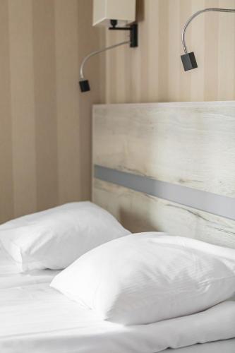Ένα ή περισσότερα κρεβάτια σε δωμάτιο στο Hotel Akwawit