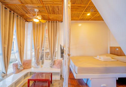 Ένα ή περισσότερα κρεβάτια σε δωμάτιο στο Hayya Hayya Villas