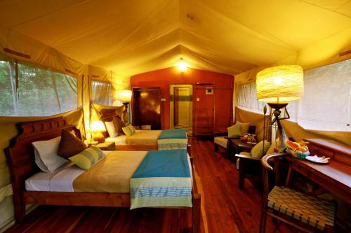 a bedroom with two beds in a tent at Mara Leisure Camp in Talek