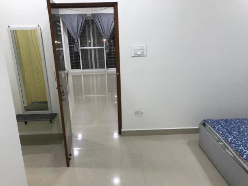 a bedroom with a mirror and a bed in it at LEO's DEN 9 Guests AC 3BHK 9 mins to RGIA in Shamshabad