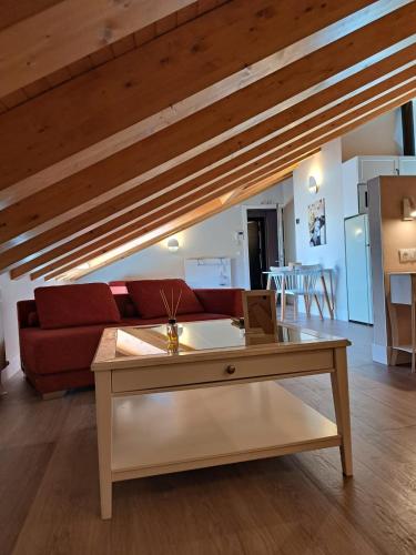 a living room with a couch and a table at La Rua 25 in Castro-Urdiales