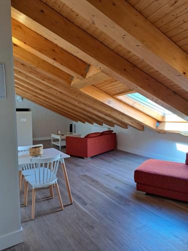 a living room with a table and a couch at La Rua 25 in Castro-Urdiales