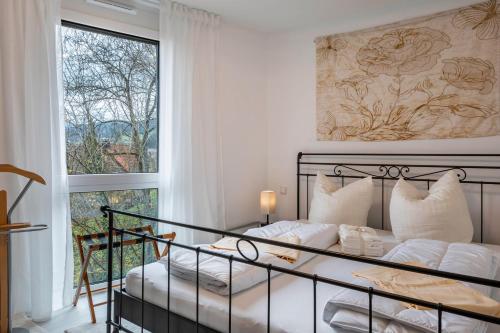 Postel nebo postele na pokoji v ubytování Felsenkeller Appartements