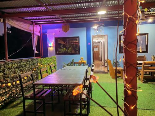 a dining room with a table and chairs at Marbeth Inn in Coron