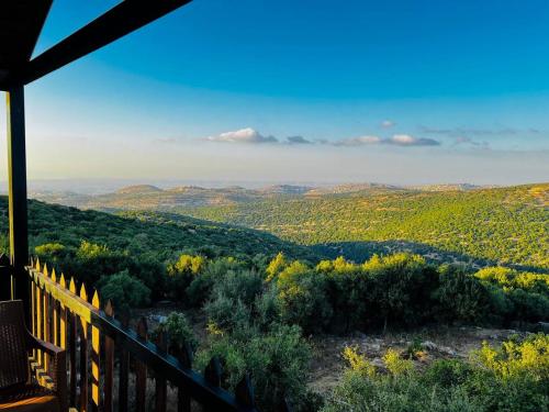 a view of the mountains from a balcony of a house at اكواخ سفاري السياحية in Ajloun
