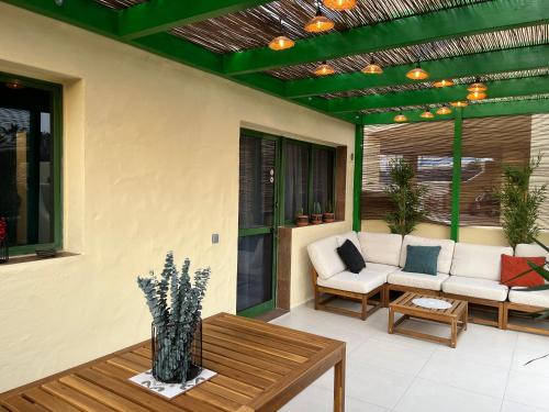 a patio with a couch and a table at La Chata in Costa Calma