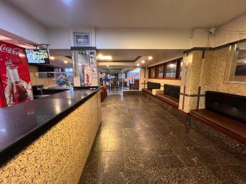 a bar in a restaurant with a long counter at HOTEL CENTRAL - Belem in Belém