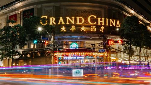 a building with a sign that reads grand china at night at Grand China Bangkok in Bangkok
