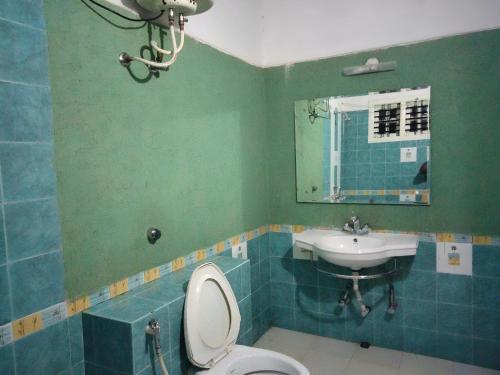 Koupelna v ubytování Prashanth Family Homestay