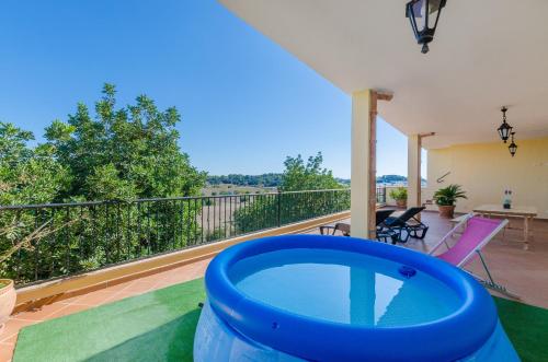a house with a swimming pool on a balcony at Can Nadal - Adults Only in Sineu