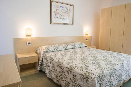 Postel nebo postele na pokoji v ubytování Garnì Mariolina