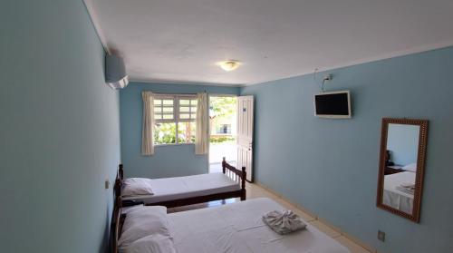 Ένα ή περισσότερα κρεβάτια σε δωμάτιο στο Big Valley Hotel Fazenda