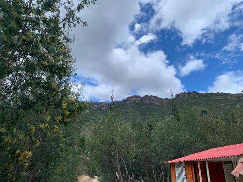 a house with a view of a mountain at Urantia Casa de la Montaña in Sutatausa