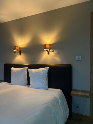 Una cama o camas en una habitación de B&B Le Briquemont