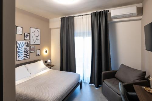 Ένα ή περισσότερα κρεβάτια σε δωμάτιο στο MIA Rooms B&B