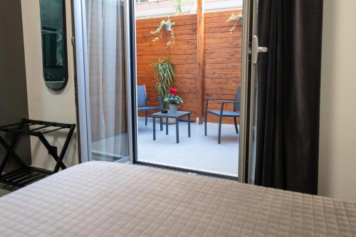 Ένα ή περισσότερα κρεβάτια σε δωμάτιο στο MIA Rooms B&B