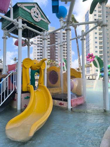 a water park with a slide in the water at Salinas Exclusive Resort in Salinópolis