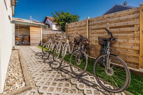a row of bikes parked next to a fence at Bregenzer Traum am Bodensee inkl Fahrräder in Bregenz