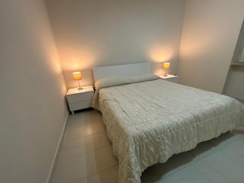 Posteľ alebo postele v izbe v ubytovaní Residence Serapo Gaeta