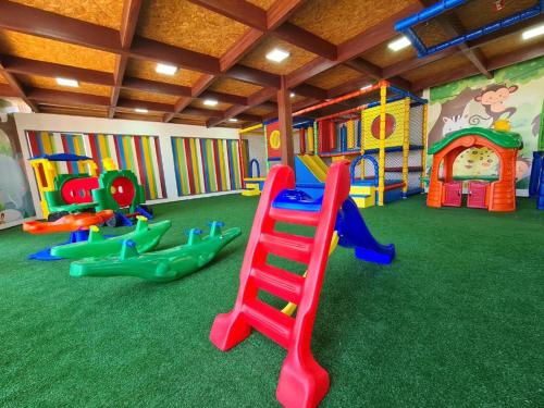 a play room with many different types of play equipment at Pousada Coqueiro Beach in Luis Correia