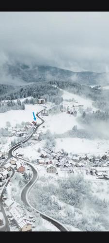 an aerial view of a town in the snow at Apartman Zlatar-Vasiljevic in Nova Varoš
