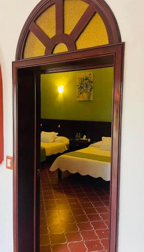 Postel nebo postele na pokoji v ubytování Casa Hotel Marchel