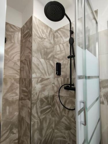 a shower with a glass door in a bathroom at La terrazza sui Nebrodi in Mistretta