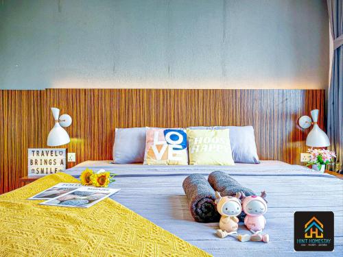 a bedroom with two beds with stuffed animals on it at Medini Elysia Park , 3 min to Legoland, Netflix By Hint Homestay in Nusajaya