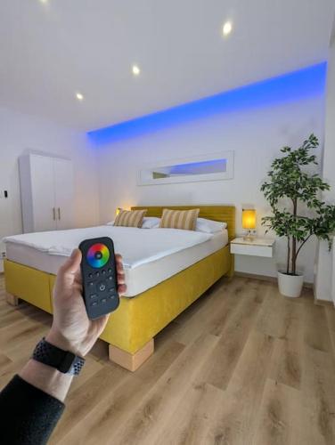 a person taking a picture of a bed in a room at Cool Apartment in Znojmo