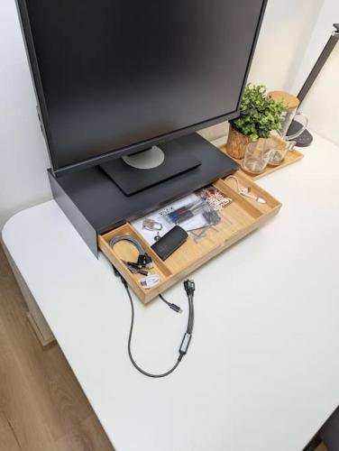 a computer monitor sitting on top of a desk at Cool Apartment in Znojmo