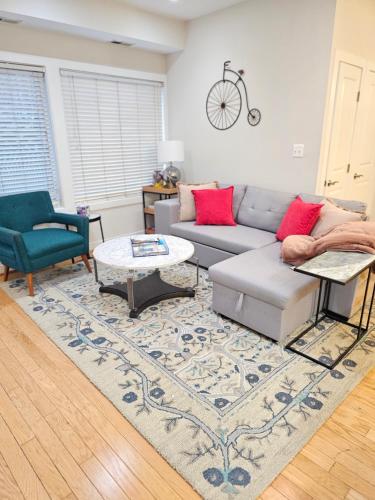 a living room with a couch and a table at Chic 2 bedroom condo at 2121 in Washington, D.C.