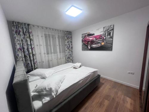 Ένα ή περισσότερα κρεβάτια σε δωμάτιο στο Helix Apartaments