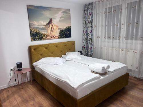 Ένα ή περισσότερα κρεβάτια σε δωμάτιο στο Helix Apartaments