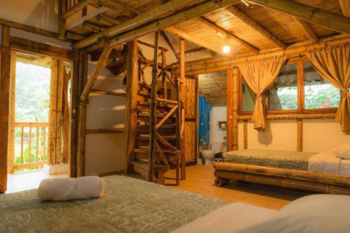 Postel nebo postele na pokoji v ubytování Finca Las Palmas Ecolodge
