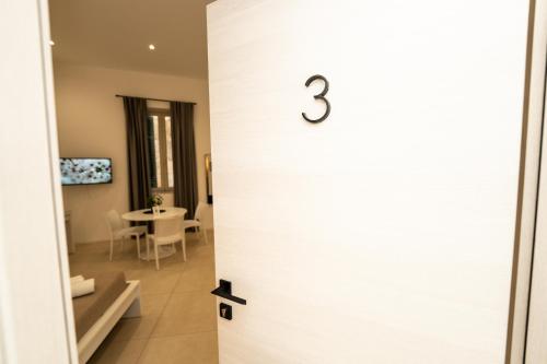 a door with the number on it at Valguarnera Studio Apartments in Palermo