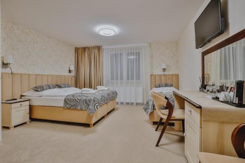 Una cama o camas en una habitación de Willa & DOM-BLACH