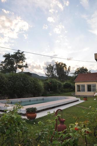 a swimming pool in the yard of a house at Finca Cielo Verde in Chicoana