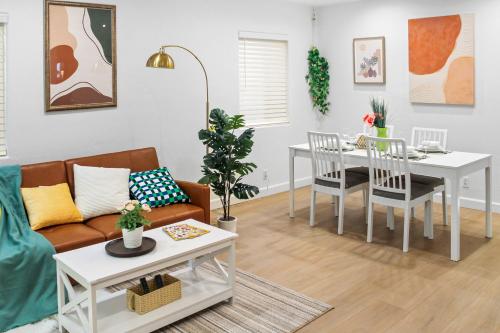 a living room with a couch and a table at Modern 2B1B Near SAP, SJSU, Convention Center in San Jose