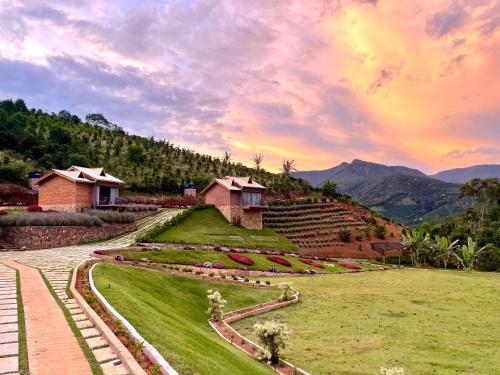 a view of a garden with a rainbow in the sky at Valle Piemonte in Divisa