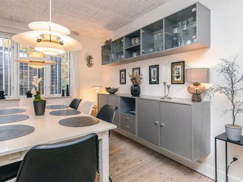 a dining room with a large table and chairs at 8 person holiday home in Bagenkop-By Traum in Bagenkop