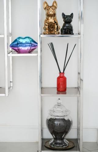 a shelf with a vase and other items on it at CoCoHoUsE in Turin