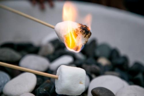 a close up of a candle in a pile of rocks at Carter's Nest Villa - New Kingston - FIWI in Kingston