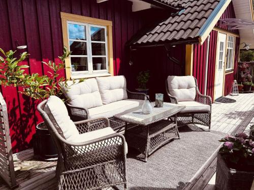 a group of chairs and a table on a patio at 4 star holiday home in UDDEVALLA in Uddevalla