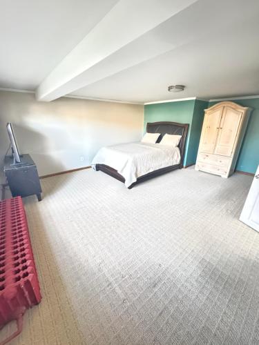 a bedroom with a bed and a dresser at Spacious 3 Bedroom Lakeview Retreat with Private Comfort & Free Parking in Watchung