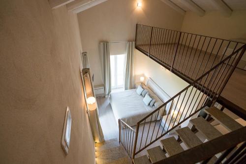 A bed or beds in a room at Locanda San Giorgio